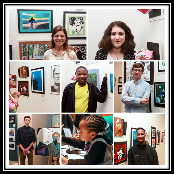 students in front of their artwork
