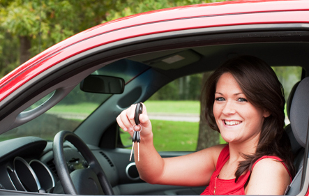 girl in a car holding keys