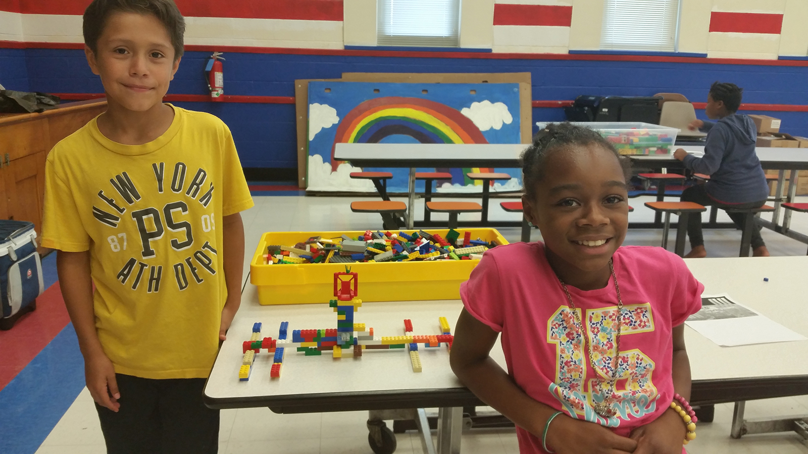 boy and girls classroom with legos