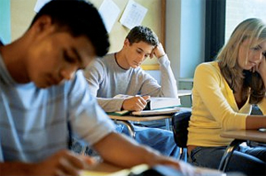 three students in a classroom