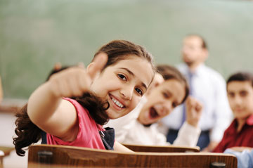 photo of a girl giving a thumbs up