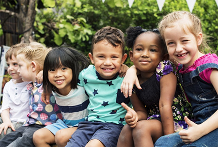 six children with arms around each other