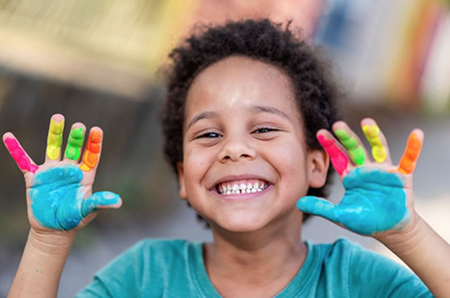 boy with paint on his hands